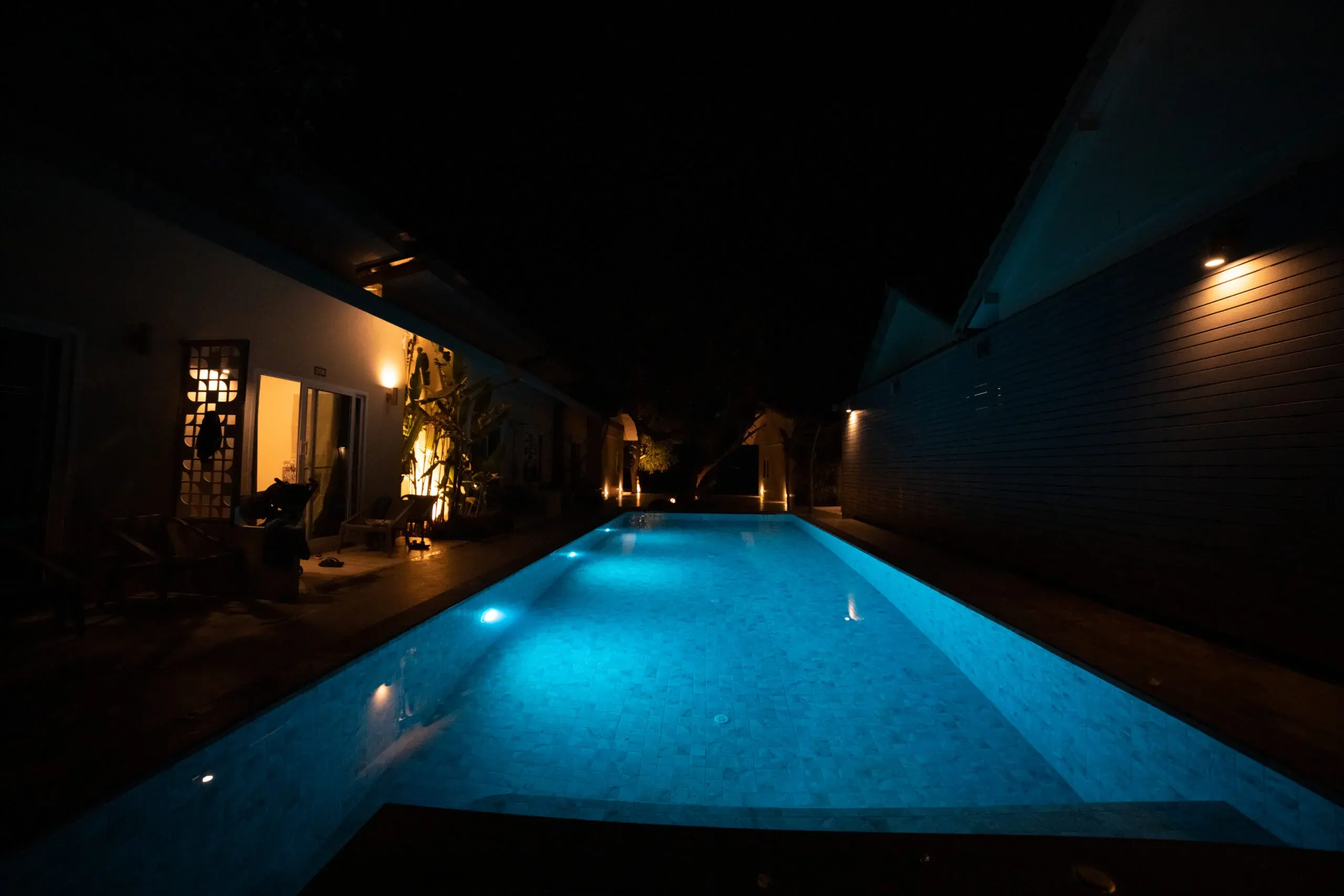 illuminated pool in the dark at night.