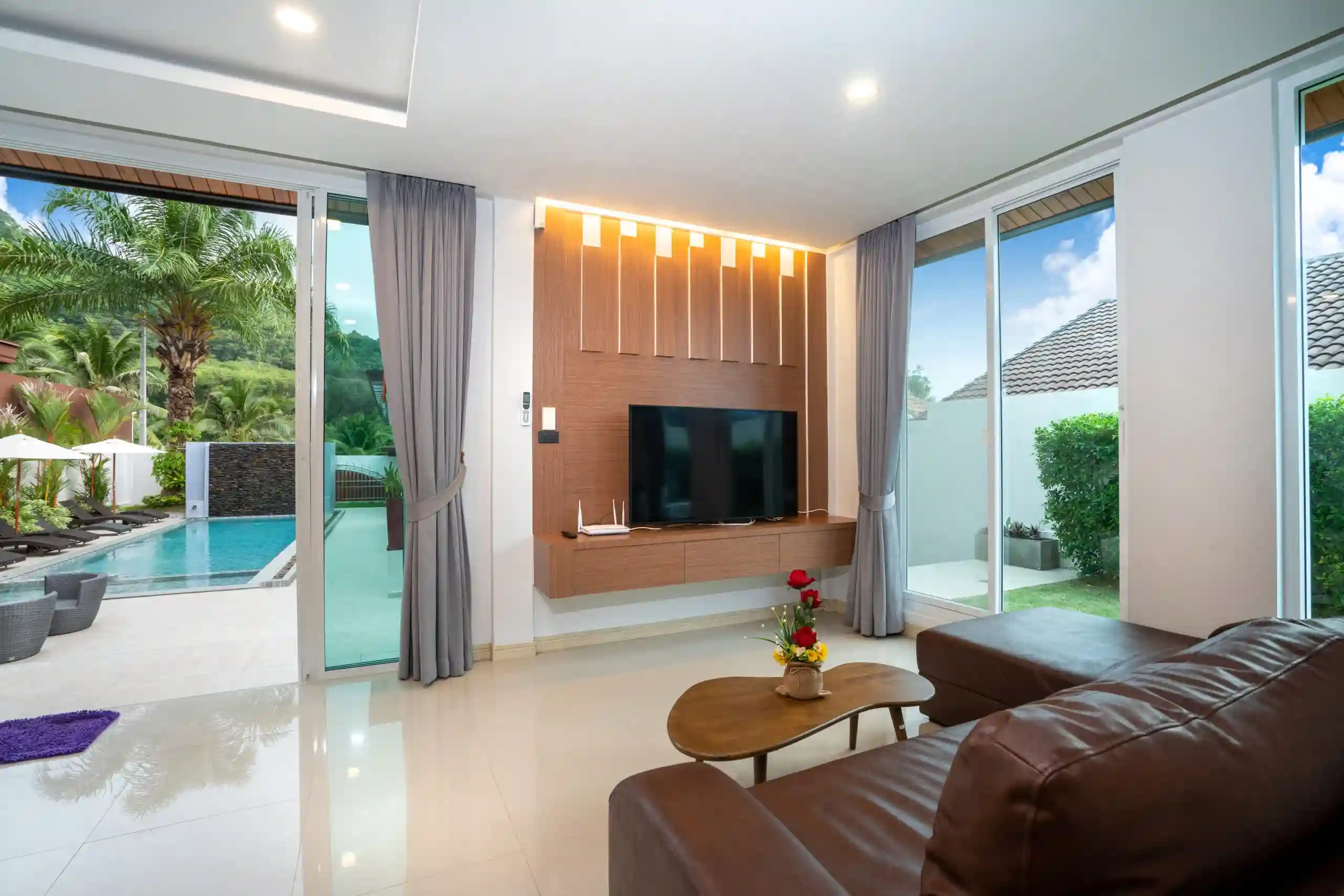 spacious living room pool access with modern decoration